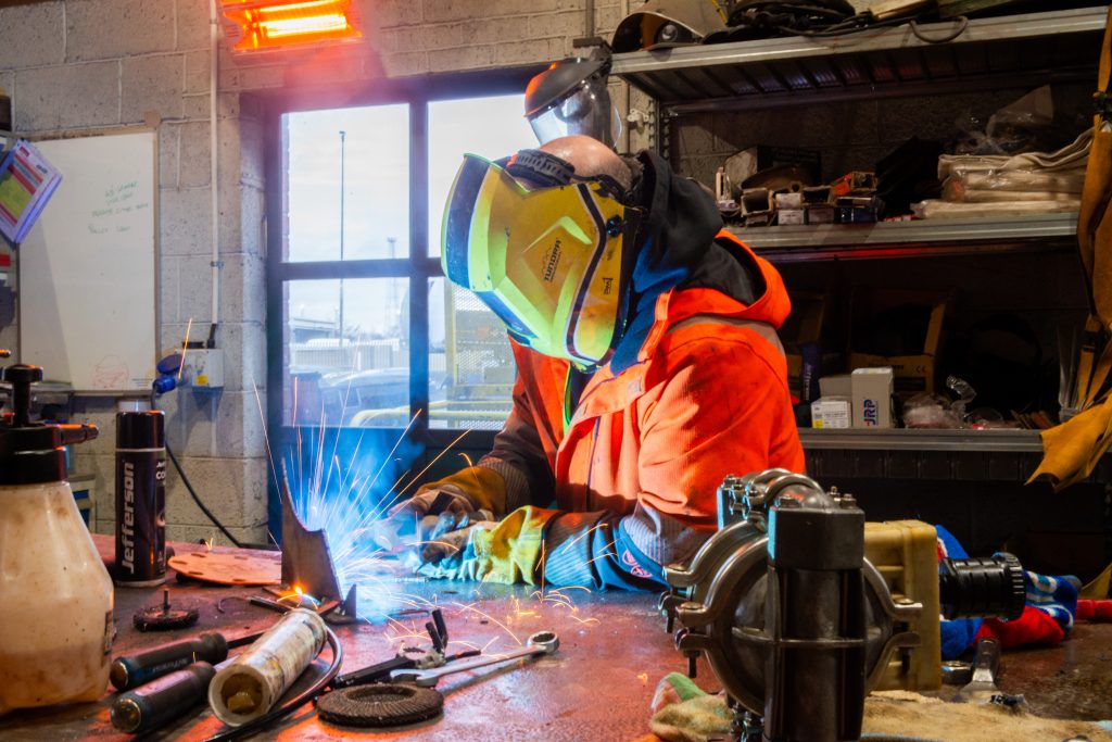a welder int he workshop at Tennants Bitumen